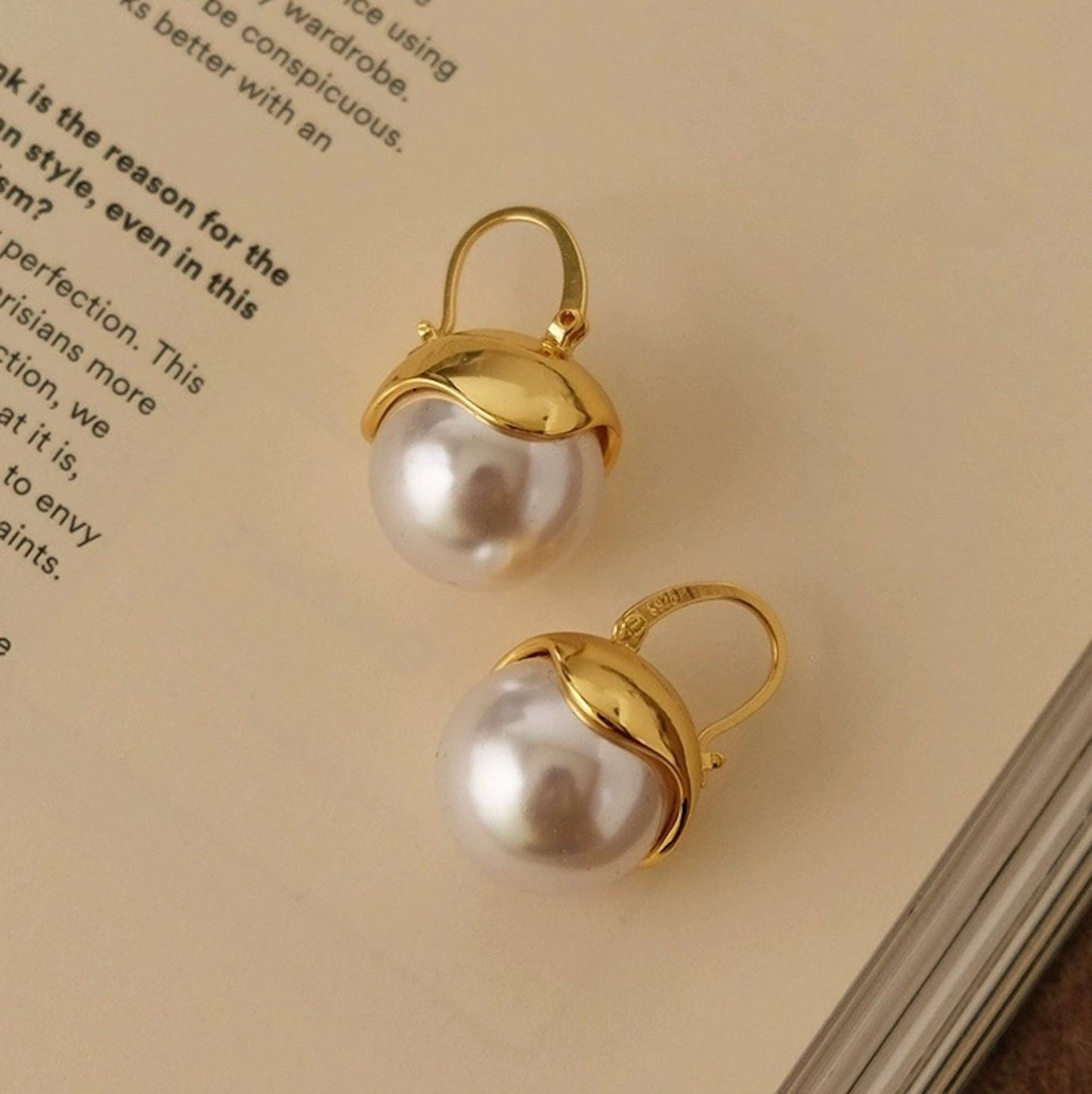 Gold and pearl drop earrings In UK